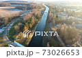 Flying above the water channel in the forest. Drone aerial footage 73026653