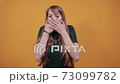 Covering mouth with palm. Can't say anything. Shocked gasping amazed stunning 73099782