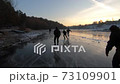 Five people skating ice river 73109901