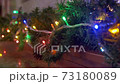 Fabulous Christmas decorations on the streets of the city, they are decorated with luminescent garlands. 73180089