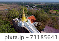 Wat Khao Rup Chang, an ancient temple of Phichit, is distinguished by the location of an ancient golden chedi on a high hill in the middle of Phichit, Thailand. 73185643