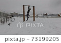 Man working out outdoors during winter 73199205