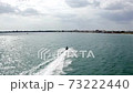 a young couple sped off into the sea on a scooter 73222440