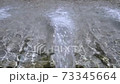 Fountain jet in slow motion in the city fountain 73345664
