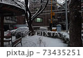 A residential area on a cloudy, snowy day 73435251