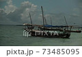 Fisherman's boat near the shore of the island of Zanzibar in the Indian Ocean. 73485095