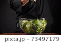 Chef peppers salad in a bowl 73497179