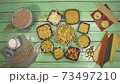 Various pasta are laid out on the table 73497210