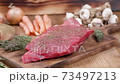 Fresh raw beef steak seasoned with spices 73497213