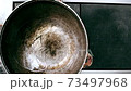 Edible oil in a cauldron for cooking 73497968