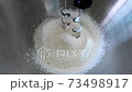 Mixing flour ingredient in stand mixer for making bakery, bread and cake. Prepare dough for baking with flour mixing machine. 73498917
