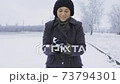 Happy woman enjoy first snow and throwing snowball 73794301