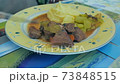 Eating a homemade stew plate 73848515