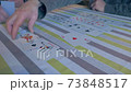 Playing cards on a table 73848517