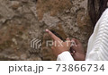 Text messaging. Woman's manicured hands using a modern smartphone, detail 73866734
