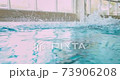 Disabled amputee athlete butterfly swimming in indoor pool 73906208