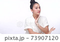 Portrait of smile young woman holding applying cosmetic cream or treatment moisturize in her face  73907120