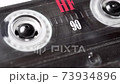 Retro audio tape copmact cassette is playing music. 73934896