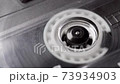 Retro audio tape copmact cassette is playing music. 73934903