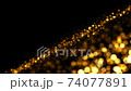 Abstract luxury background with golden glitter lights on black. Depth of field particles. Seamless loop animation of sparkling gltters.  74077891