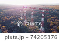 Aerial view high voltage post. around of Tree High voltage towers. Group of transmission towers or power tower, electricity pylon, steel lattice tower 74205376