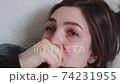 Young woman suffering from depression. The girl experiences sadness, crying, tears 74231955