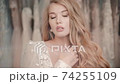 Closeup view of beautiful young bride is posing for camera in light studio. 74255109