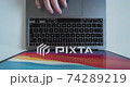 User unlocks laptop with fingerprint scanner and starts working - top-view footage 74289219
