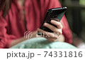 Closeup hand of woman having video call on her smartphone. 74331816