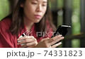 Woman using online banking with smart phone. 74331823
