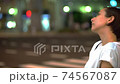 Women in the crowd (night, cityscape, city) 74567087