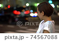 Women in the crowd (night, cityscape, city) 74567088