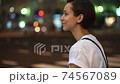 Women in the crowd (night, cityscape, city) 74567089