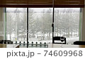 Snow outside the window 74609968