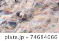 Soap foam is changing on black background. Close 74684666