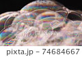 Foam of soap close up. Color gradient on the sides 74684667