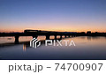 Oga Line train crossing the bridge in the morning glow 74700907