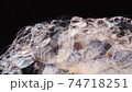 Soap foam move down on black background. Close-up 74718251