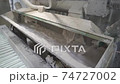 Manufacturing or production of plaster or gypsum mix. Apparatus or machine mixer for kneading or mixing gypsum and water in the factory or plant 74727002