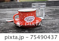 Homemade coffee in red enamel cup 75490437