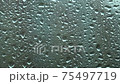 Raindrops running on glass 75497719
