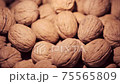 Walnuts in a basket run Walnuts in a basket run 75565809