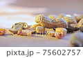 Detail of peanuts in shell and out moving recovery in pan Detail of peanuts in shell and out moving recovery in pan 75602757