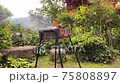 Preparing a barbecue in the country garden 75808897
