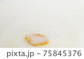 one yellow gold cornflake cerealfalling into milk slow motion 75845376