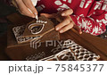 woman girl decorating christmas gingerbread making a house royal icing 75845377