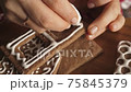 woman girl decorating christmas gingerbread making a house royal icing 75845379