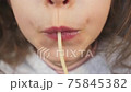 macro close up lips mouth sucking spaghetti string girl 75845382