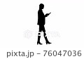 Silhouette Disapprovingly looking business woman using her phone. 76047036