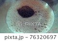 Hot drink : putting some chocolate powder in (vegan almond) milk 76320697